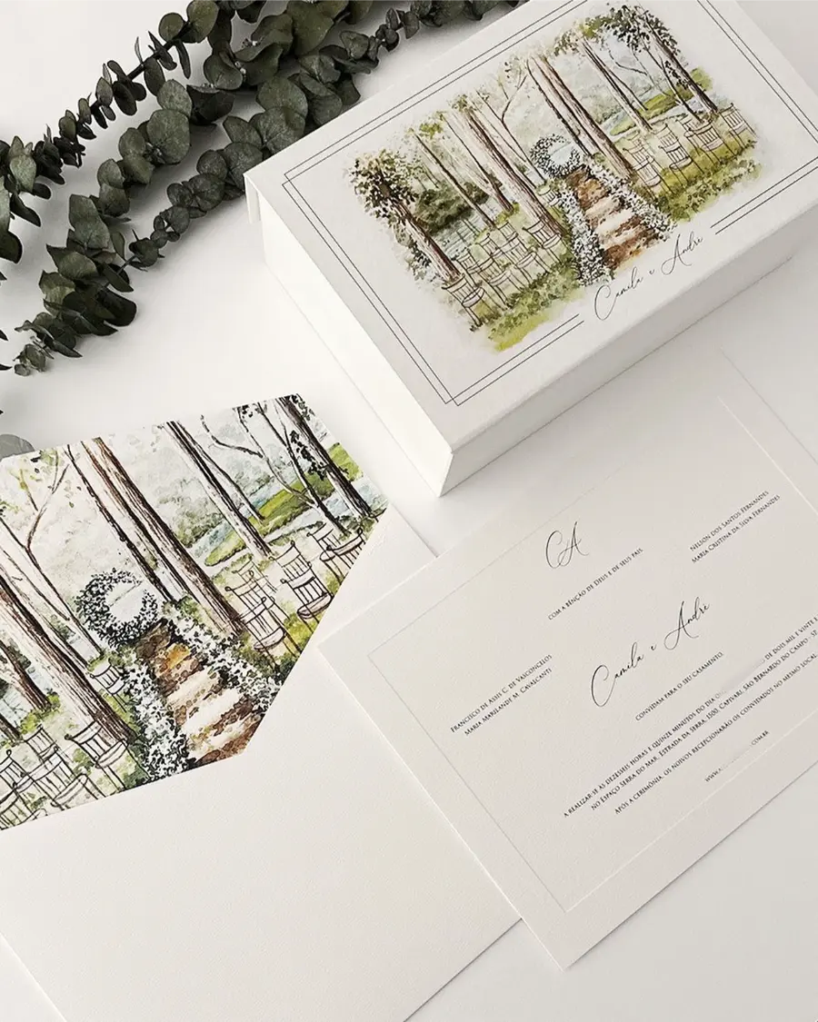 Convite de casamento ilustrado com aquarela de cerimônia ao ar livre, caixa personalizada e envelope decorado com arte botânica delicada.